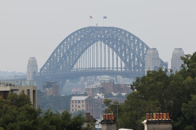 <p>A view of the Sydney Harbour Bridge shrouded in smog from nearby bushfires in Sydney, Australia</p>